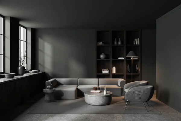 グレーの壁 コンクリートの床 2つの灰色のアームチェア 快適なグレーのソファ 丸みを帯びたコーヒーテーブルと木製の本棚とスタイリッシュなリビングルームのインテリア 3Dレンダリング — ストック写真