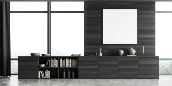 Dark living room interior with black wooden dresser on grey concrete floor, art decoration with books. Panoramic window on countryside. Mock up canvas poster. 3D rendering