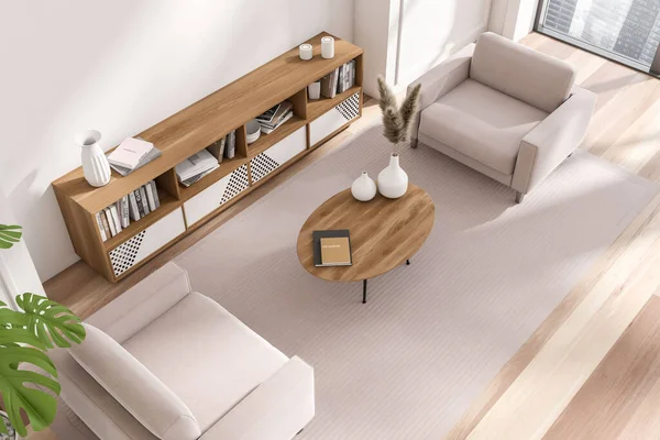 Top view of white meeting interior with soft armchairs, coffee table and sideboard with decoration, carpet on hardwood floor. Panoramic window on city skyscrapers. 3D rendering