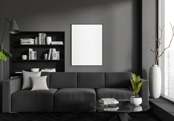 Dark living room interior with sofa and coffee table, shelf with books and decoration, black hardwood floor. Panoramic window on city skyscrapers. Mock up canvas poster. 3D rendering