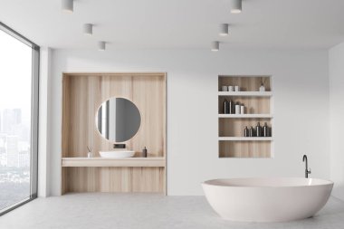 Beyaz ve ahşap duvarları, beton zemini, rahat küveti, yuvarlak aynalı lavabosu ve kozmetik ürünleriyle dolu rafları olan şık bir banyo. 3d oluşturma