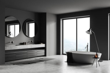 Karanlık banyo iç tarafında iki yuvarlak ayna, küvet, lavabo kırsal manzaralı panoramik pencere, gri duvarlar, beton zemin, musluğun altında raflar, sıvı sabun. 3d oluşturma