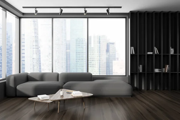 Stylish dark living room interior with sofa and coffee table on hardwood floor. Shelf with books, panoramic window on Singapore skyscrapers. 3D rendering