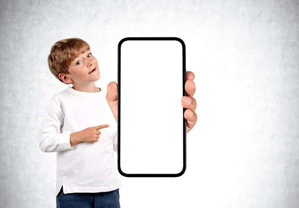 Boy Kid Smiling Finger Pointing Big Smartphone Mock Copy Space — Stock Photo, Image