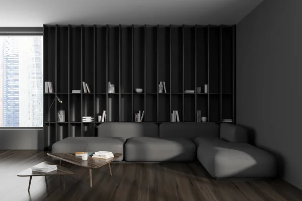 Dark relaxing corner interior with sofa and coffee table on hardwood floor. Long shelf with books, panoramic window on Singapore city view. 3D rendering