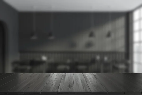Черный Деревянный Стол Размытый Фон Темного Интерьера Кафе Стульями Столом — стоковое фото