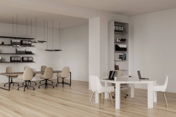 White business coworking interior with office chairs and laptop on a shared table, side view. Conference workspace and shelf with decoration and folders. 3D rendering