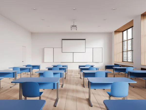 White and blue class room interior with desk and chairs in row, mock up empty chalkboard and screen with projector on ceiling. Panoramic window on skyscrapers. 3D rendering