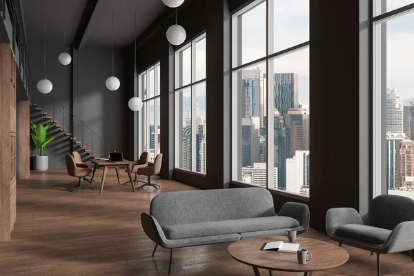 Interior of stylish meeting room with gray walls, wooden floor, long conference table with chairs and lounge area with cozy gray sofa and armchair near big window. 3d rendering
