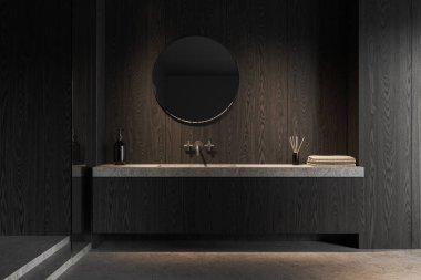 Karanlık ev banyosu lavabosu ve yuvarlak aynası güvertede havlusu olan aksesuarlar, gri beton zemin. Minimalist banyo alanı olan modern bir daire. 3B görüntüleme