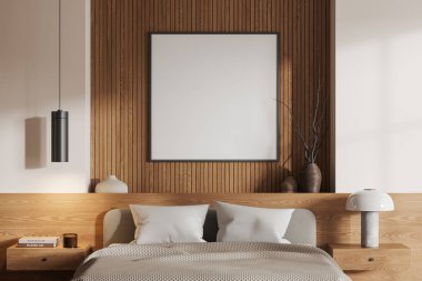 Otel odasının içi rahat yatak odası, kitaplar, dekorasyon, yastık ve çarşaflarla dolu komodin. Tahta dizaynlı gevşetici alan. Duvara kare tuval posteri yap. 3B görüntüleme