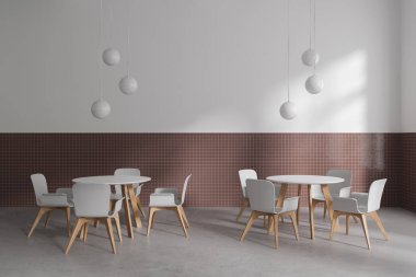 Minimalist restoranın içinde beyaz sandalyeler ve yuvarlak masa, gri beton zemin. Modern mobilyaları ve lambaları olan şık bir kafe. 3B görüntüleme