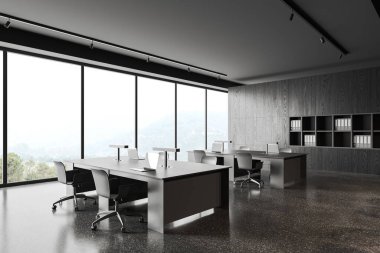 Masada koltukları ve dizüstü bilgisayarı olan karanlık modern ofis, yan görüş gri beton zemin. Kırsal kesimde raflı ve panoramik pencereli minimalist çalışma alanı. 3B görüntüleme