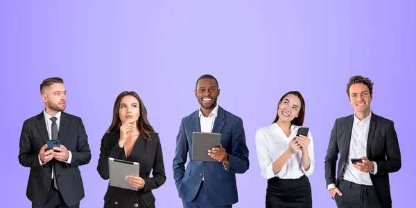 Five business people in row working together, smiling portraits on copy space purple background background. Using smartphone and tablet for online network. Concept of teamwork and conference
