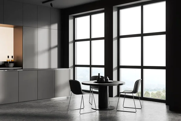 有灰色墙壁 混凝土地面 舒适的灰色橱柜和靠窗的圆形餐桌的时尚厨房角落 3D渲染 — 图库照片