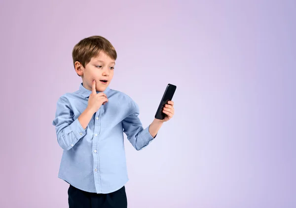 Child Boy Holding Phone Ponder Look Finger Cheek Empty Copy — Stock Photo, Image