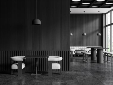 Gri ve koyu ahşap duvarları olan şık bir restoranın içi, siyah fayanslı zemin, yanında beyaz kanepeler, koltuklar ve tabureler olan kare masalar. 3d oluşturma