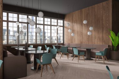 Gri ve koyu ahşap duvarları olan şık bir kafe, ahşap zemin, rahat yuvarlak ve mavi sandalyeli oval masalar ve yumuşak kahverengi koltuklar. 3d oluşturma