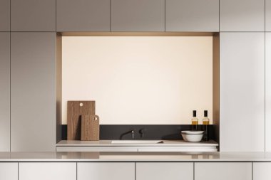 Long Bar Adası 'nın içindeki bej mutfak. Güvertede modern mutfak gereçleri ile lavabo. Yeni stüdyo dairede minimalist tasarımı olan rahat ev yemekleri bölümü. 3B görüntüleme
