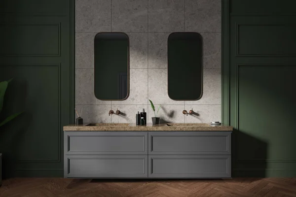 Traditional green home bathroom interior with double sink and grey vanity, two mirror and bathing accessories. Molding wall and hardwood floor. 3D rendering