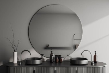 Çift lavabolu ve yuvarlak aynalı karanlık banyo. Minimalist banyo aksesuarları ve dekorasyonu olan bir güverte. 3B görüntüleme