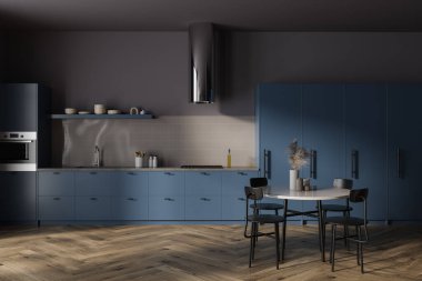 Yemek masası ve sandalyeleri olan gri ve mavi mutfak dolabı, lavabosu, ocağı ve fırını olan pişirme alanı. Yemek ve yemek alanı olan minimalist bir daire. 3B görüntüleme