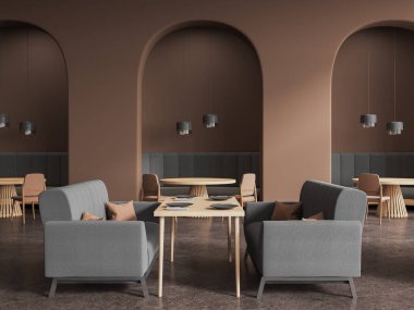Gri kanepesi ve sıralı sandalyeleri, kemerli duvarı ve beton zemini olan minimalist, karanlık restoran içi. Modern mobilyaları ve lambaları olan şık bir kafe. 3B görüntüleme