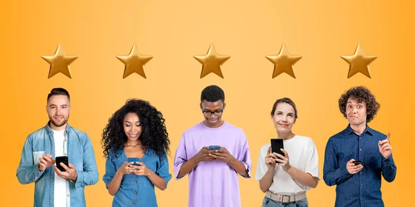 Young man and woman typing in phone, portraits in row and five gold stars above their heads. Concept of customer experience, review, rating and online feedback