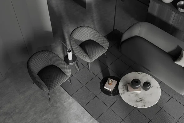 ソファと2つのアームチェア 本と装飾の大理石コーヒーテーブル 灰色のコンクリート床のカーペットを備えたダークリビングルームのインテリアのトップビュー 3Dレンダリング — ストック写真
