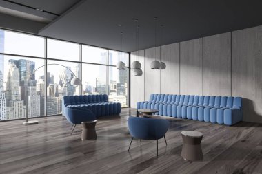 Gri ve ahşap duvarları olan şık ofis bekleme odasının köşesi, koyu ahşap zemin, iki rahat mavi kanepe ve koltuklar ve bej kahve masaları. 3d oluşturma