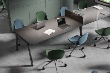 Minimalist ofis manzarası koltuklu, dizüstü bilgisayarı bölmeli, gri beton zeminli. Teknoloji ve mobilyalarla ortak çalışma alanı. 3B görüntüleme