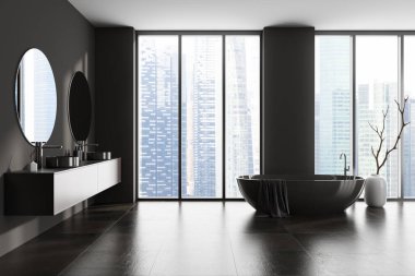 Banyonun iç tarafında küvet, panoramik pencere, Singapur şehri gökdelenleri, çift lavabo, iki yuvarlak ayna, gri duvarlar, vazo, beton zemin, havlu. 3d oluşturma