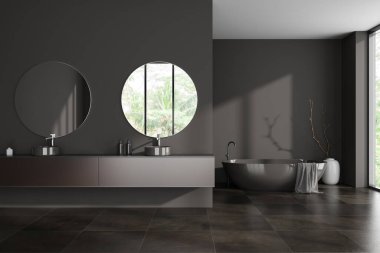 Koyu banyonun içini banyo küveti, panoramik penceresi, kırsal manzarası, çift lavabo, iki yuvarlak ayna, gri duvarlar, vazo, beton döşeme, havlu. 3d oluşturma