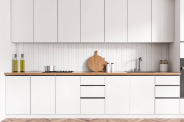 Beyaz mutfak içi lavabo ve ocakla dolu, güvertede minimalist mutfak gereçleri. Ahşap zeminde gizli tasarımı olan yemek pişirme alanı. 3B görüntüleme