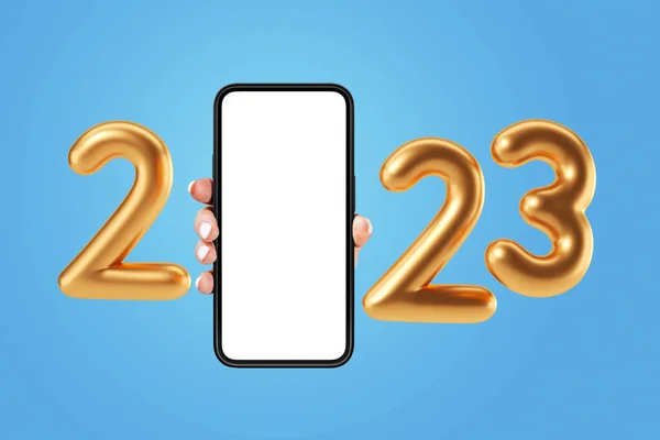 大きな空のモックアップ画面を持つスマートフォンを握っている女性の手 青い背景の黄金の2023番号 新年のコンセプトとつながり — ストック写真