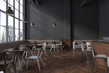 Gri duvarları, koyu ahşap zemini, rahat gri koltukları ve yuvarlak masaların yanında duran ahşap sandalyeleri olan şık bir restoran. 3d oluşturma
