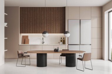 Bej renkli ev mutfağı oval yemek masası, sandalyeler, açık beton zemin. Dolap rafları, buzdolabı ve mutfak gereçleri ile yemek pişirme alanı. Kırsal kesimde panoramik pencere. 3B görüntüleme