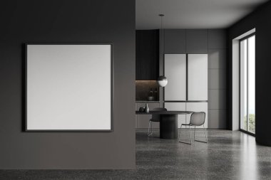Gri duvarları, beton zemini, gri ve koyu ahşap dolapları, büyük buzdolabı ve sandalyeli uzun yemek masası olan şık bir mutfak. Sol taraftaki kare maket posteri. 3d oluşturma