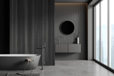 Lavabo, küvet, kırsal manzaralı panoramik pencere, yuvarlak ayna, gri duvarlar, ahşap bölme, halı, beton zemin, havluyla tabure. 3d oluşturma