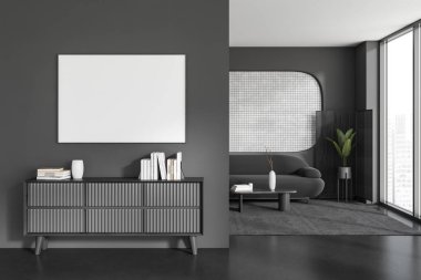 Karanlık oturma odasının ön tarafı boş beyaz poster, panoramik pencere, kanepe, sehpa, beton zemin, büfe, kitaplar. Minimalist tasarım kavramı. Model yap. 3d oluşturma