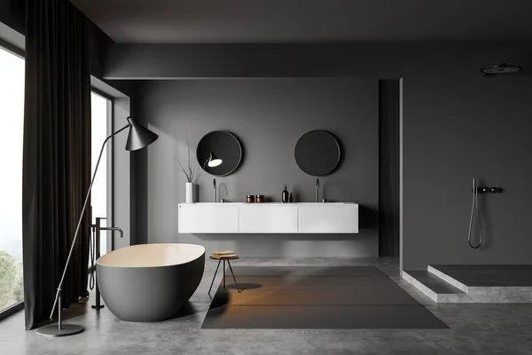 Dark bathroom interior with double sink and shower on podium, bathtub near panoramic window. Dresser with bathing accessories, carpet on grey concrete floor. 3D rendering