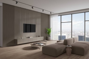 Modern oturma odasının köşesinde bej duvarlar, ahşap zemin, rahat bej kanepe, iki yuvarlak sehpa ve dolabın üstünde asılı büyük ve modern bir televizyon. 3d oluşturma