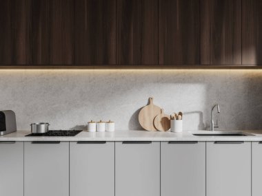 Beyaz duvarları olan modern mutfağın içi, ocağı ve lavabosu olan rahat gri dolaplar ve üzerlerinde siyah ahşap dolaplar asılı. 3d oluşturma