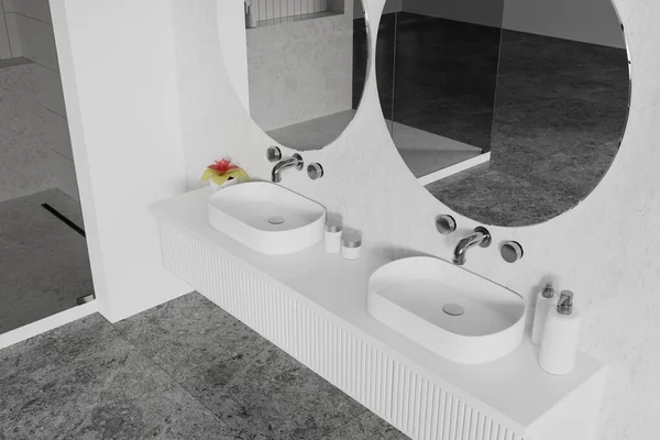 Top view of white home bathroom interior with double sink and round mirrors, grey tile concrete floor. Elegant hygiene space with accessories and decoration on vanity. 3D rendering