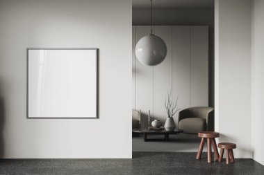 Beyaz duvarları, beton zemini, yuvarlak sehpanın yanında duran rahat koltuğu ve duvarda kare şeklinde afişi olan modern oturma odasının içi. 3d oluşturma