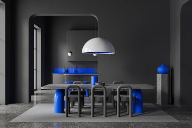 Gri duvarları, beton zemini, sandalyeli uzun yemek masası ve arka planda mavi ve gri dolapları olan rahat mutfağı olan şık bir yemek odası. 3d oluşturma