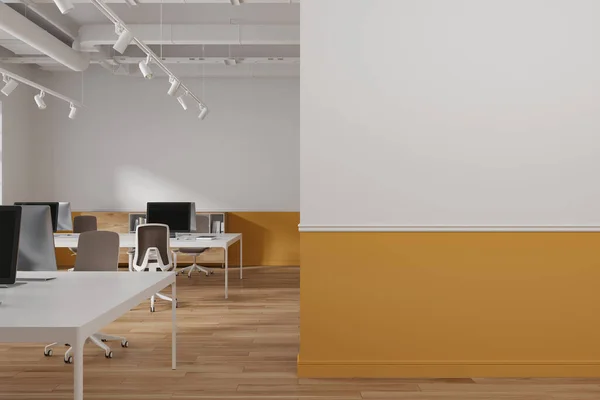 Interior of modern open space office with white and orange walls, wooden floor, massive computer desks with chairs and copy space wall on the right. 3d rendering