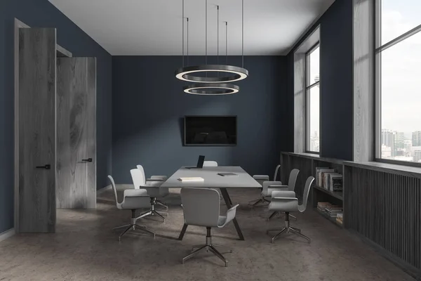Interior of stylish meeting room with blue and wooden walls, concrete floor, long conference table with white chairs and TV on the wall. 3d rendering