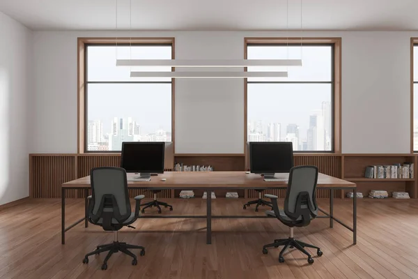 White and wooden office interior with armchairs and pc monitors on table, hardwood floor. Minimalist workspace with sideboard and decor, panoramic window on Singapore skyscrapers. 3D rendering
