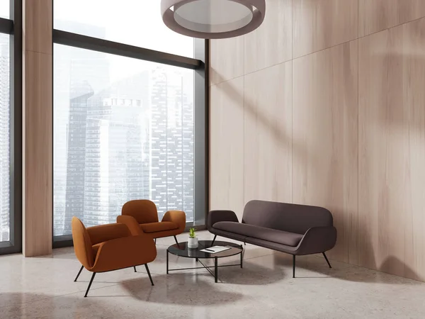 stock image Modern business relax interior with brown sofa and two orange armchairs, side view meeting or consulting corner with coffee table and panoramic window on Singapore skyscrapers. 3D rendering